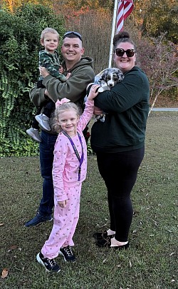 The Roberts family with Winston